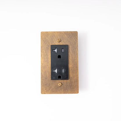 20A multi-finish wall outlet — Retro Black brass panel, standard socket | Casa Norex