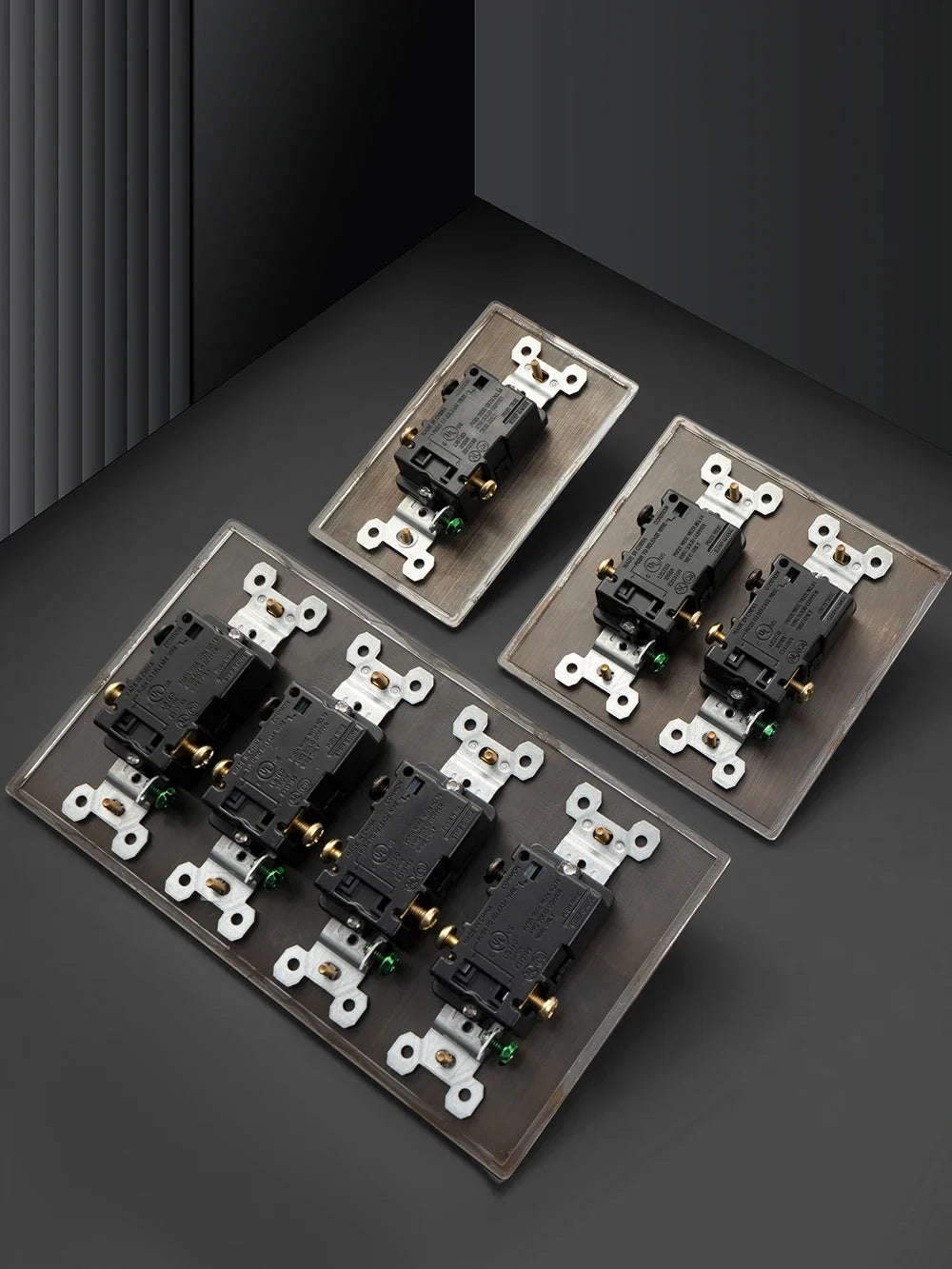 Hammered brass toggle switch panel finish close-up — Casa Norex