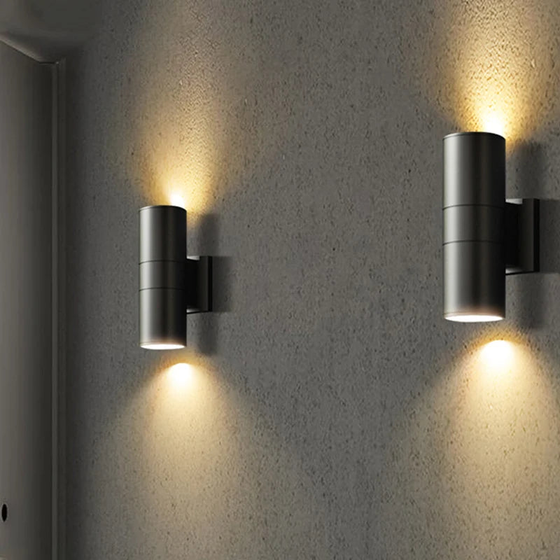 Round housing outdoor wall light, up & down two-head design | Casa Norex