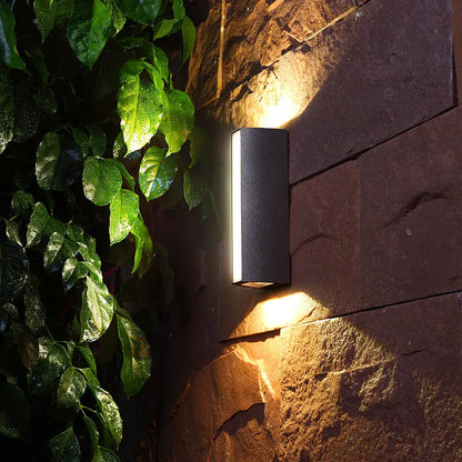 Porto aluminum wall light warm white glow at night — Casa Norex