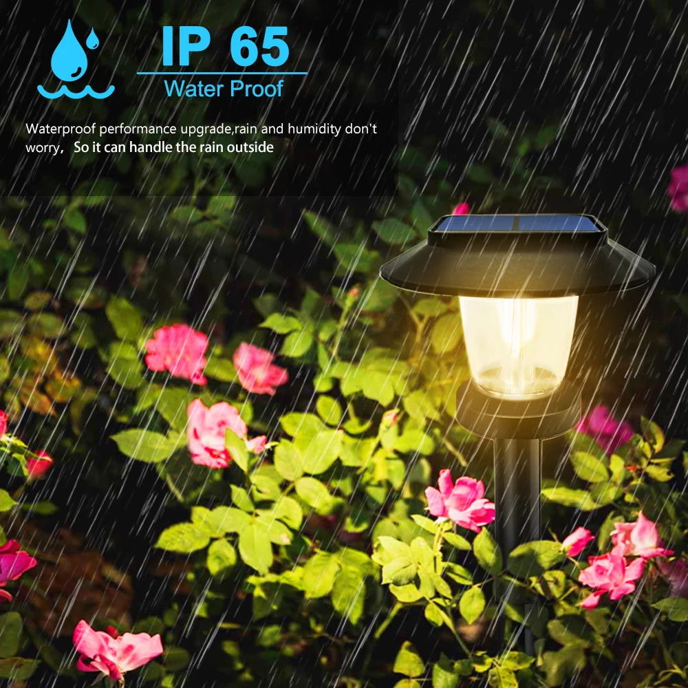 Solar filament pathway light glowing with warm amber light at night