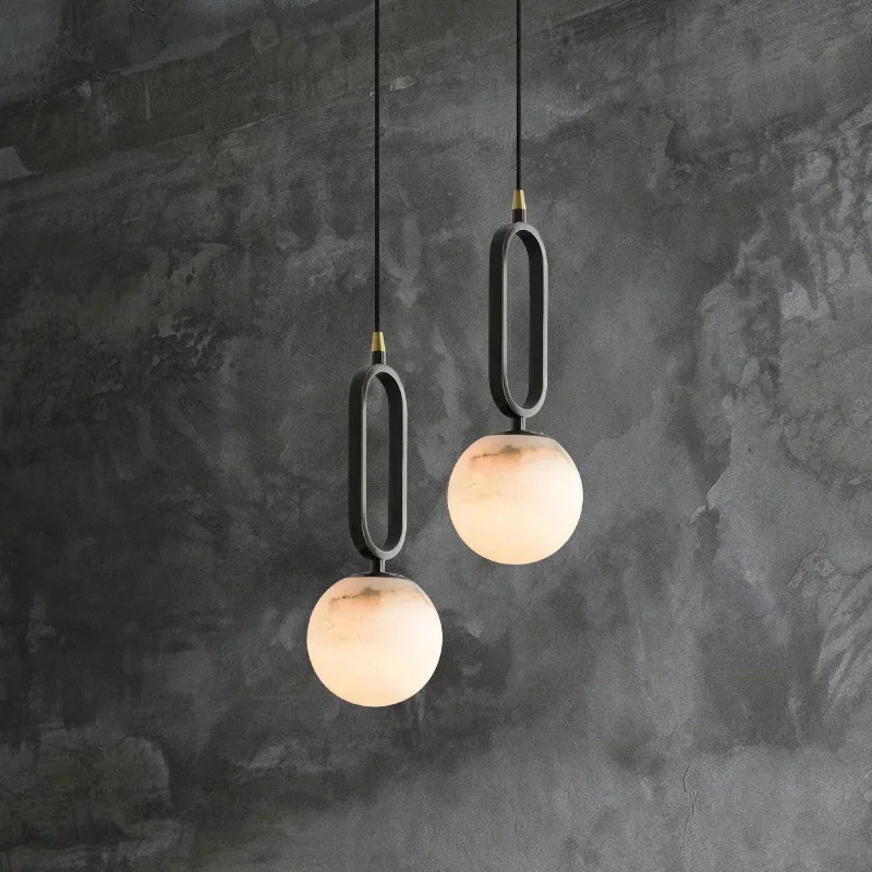 Close-up of natural marble globe shade on Selene pendant light | Casa Norex