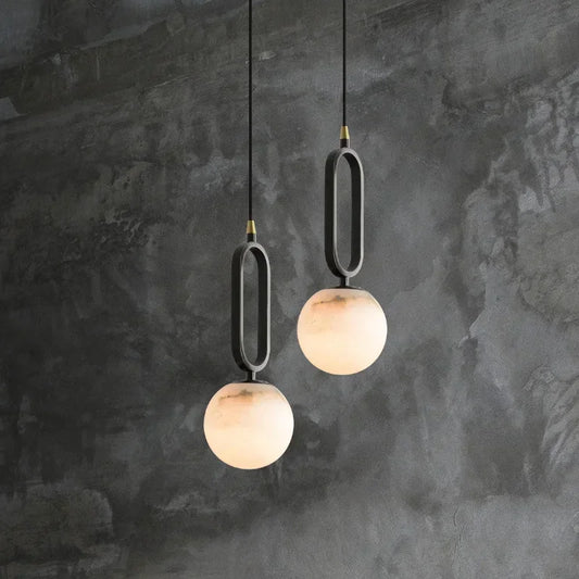 Close-up of natural marble globe shade on Selene pendant light | Casa Norex