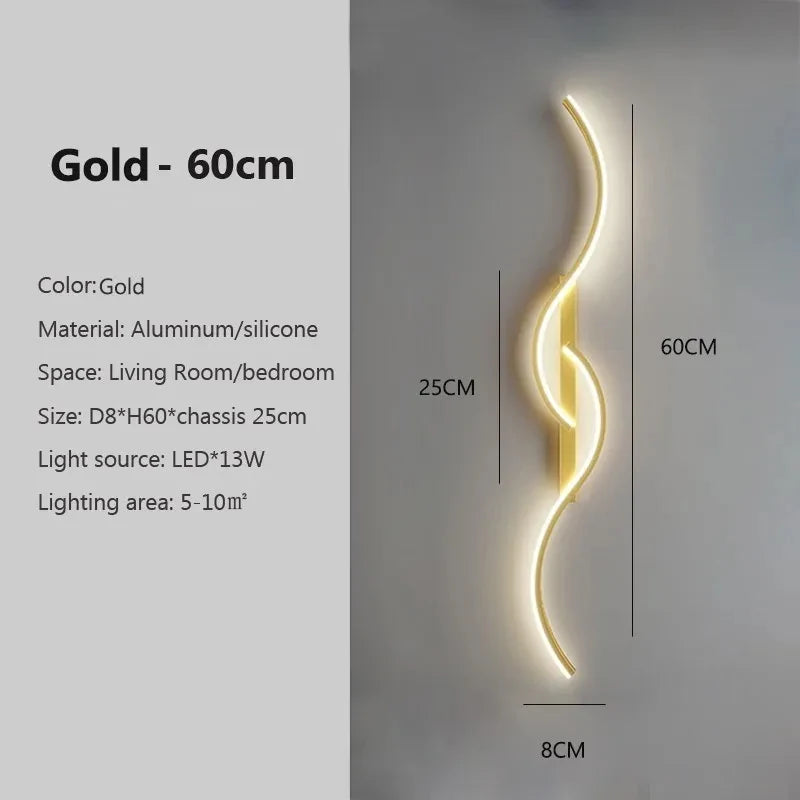 Strato linear wall sconce warm white glow above a bed — Casa Norex