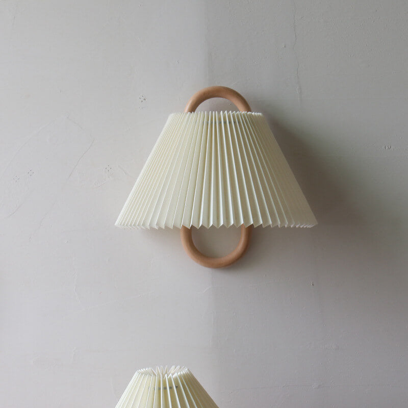 Solid wood wall sconce — pleated beige fabric shade in semi-circle silhouette | Casa Norex