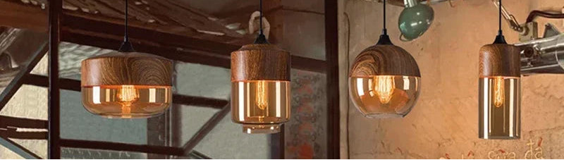 Amber glass pendant lights hanging in an industrial café above a coffee counter | Casa Norex