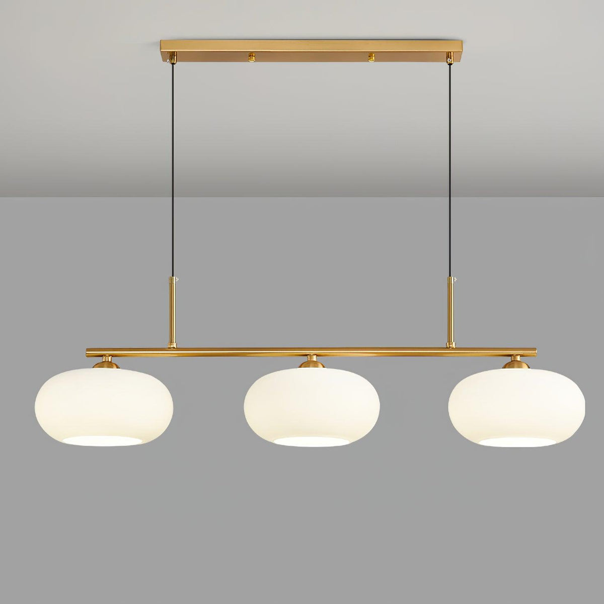 Pendant light in dining room setting — warm globe glow | Casa Norex