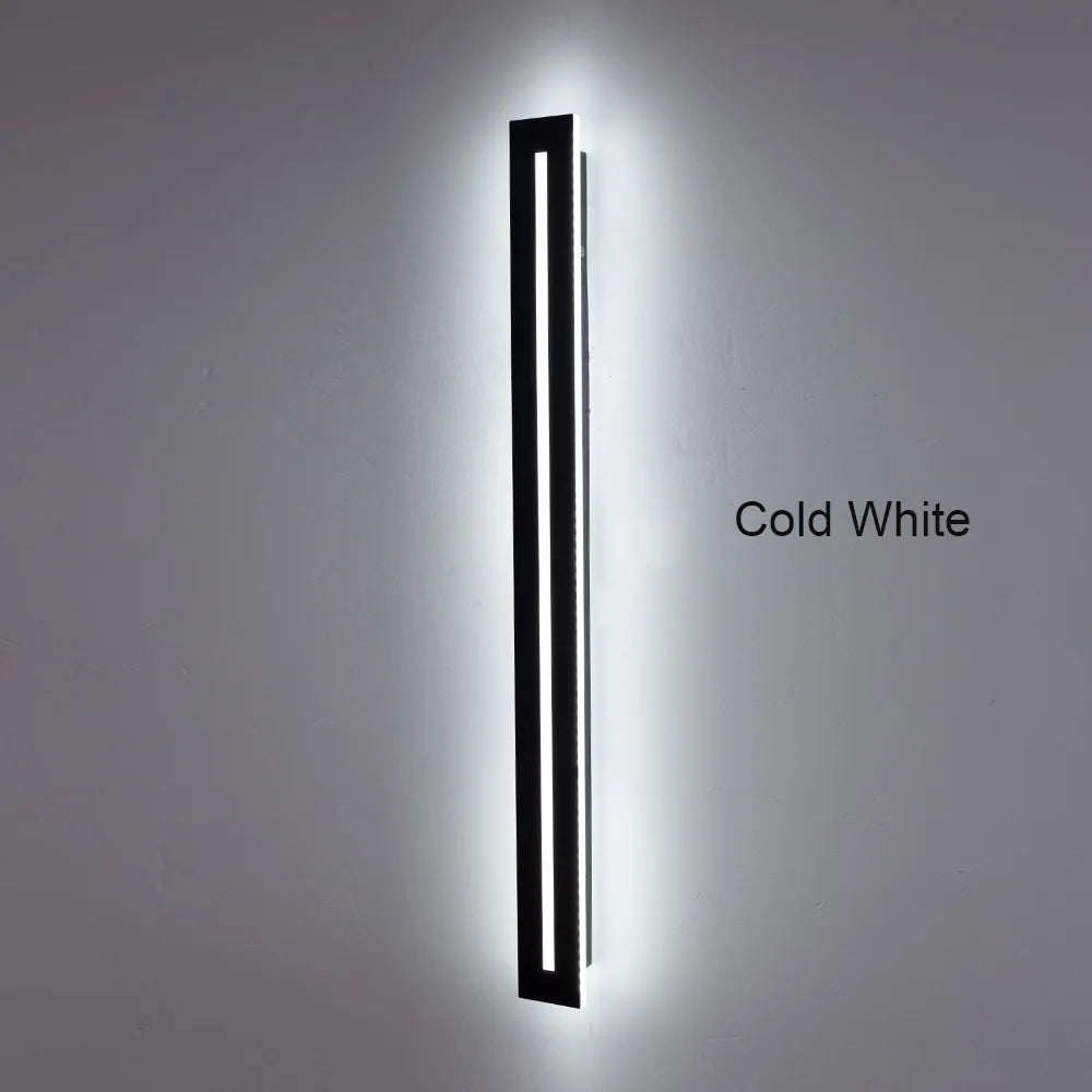 Outdoor wall light mounted beside entrance — warm white LED glow | Casa Norex
