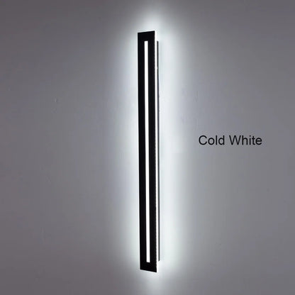 Outdoor wall light mounted beside entrance — warm white LED glow | Casa Norex