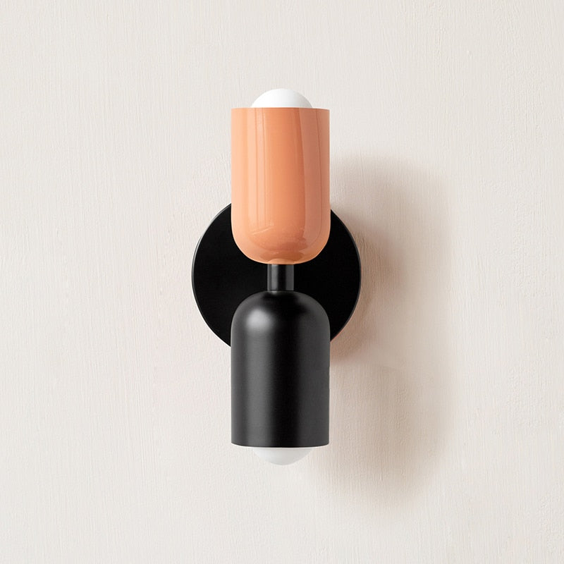 Dual-bulb wall sconce colorblock design in living room setting — Casa Norex