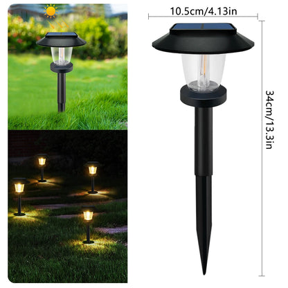 Solar filament pathway light staked along a garden path