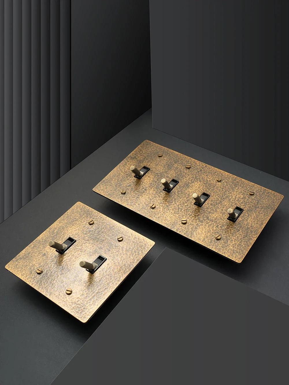 Hammered brass wall outlet installation detail — Casa Norex
