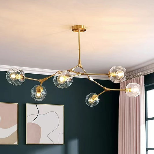 Clear globe arm chandelier — staggered brass arms with glass globes | Casa Norex