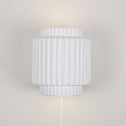 Tristan pillared resin plug-in wall lamp white indented columns | Casa Norex