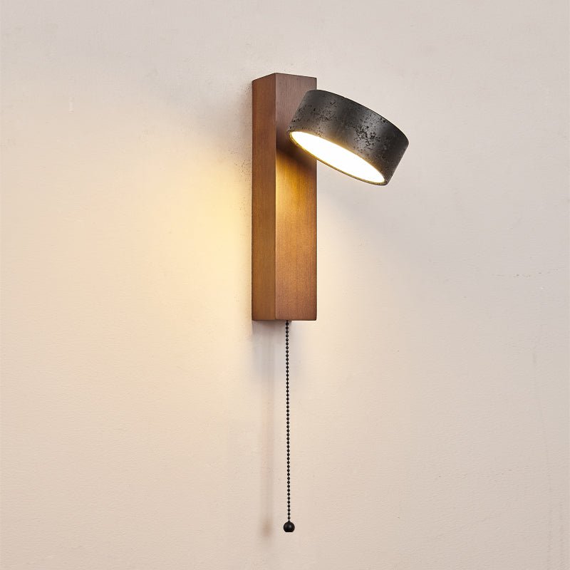 Wall sconce side angle — black travertine and walnut | Casa Norex