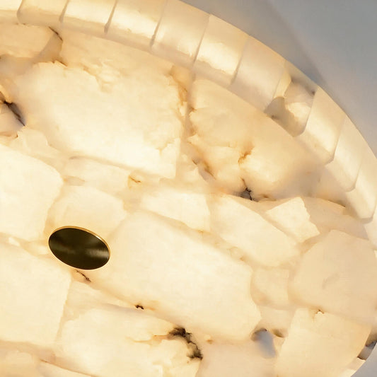 Round alabaster flush mount in living room setting — warm ambient glow | Casa Norex