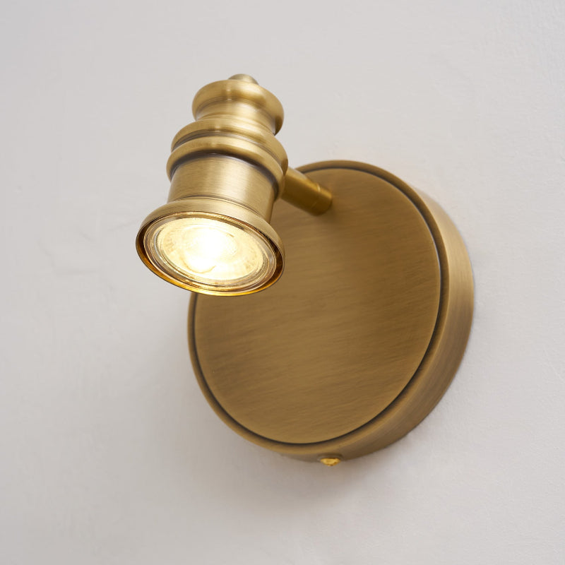 Brass wall sconce — single spotlight head on a round backplate | Casa Norex