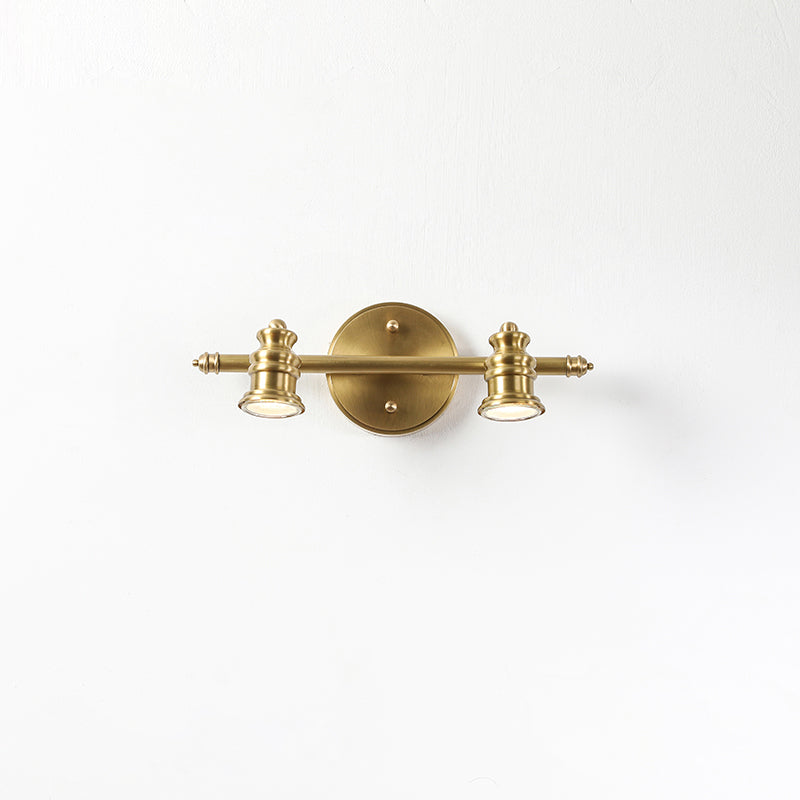 Brass wall sconce setting — two-head spotlight bar on white | Casa Norex