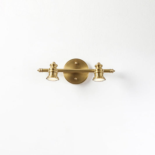 Brass wall sconce setting — two-head spotlight bar on white | Casa Norex