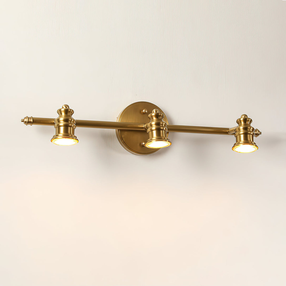 Two-head brass spotlight bar wall sconce on a pale wall — Casa Norex