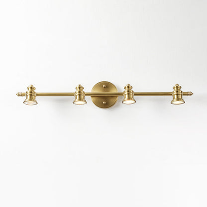 Three-head brass spotlight bar wall sconce on a white wall — Casa Norex
