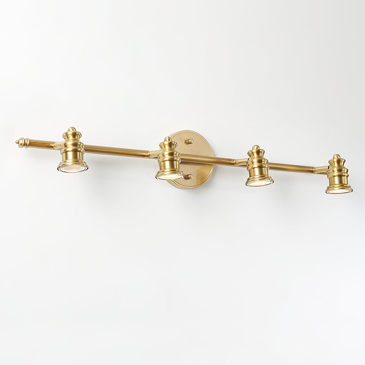 Three-head brass spotlight bar with a round backplate — Casa Norex