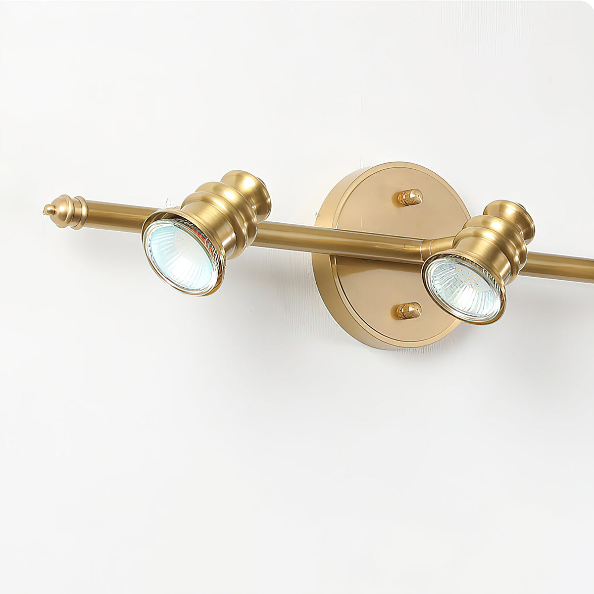 Close-up of two brass spotlight heads on a bar — Casa Norex