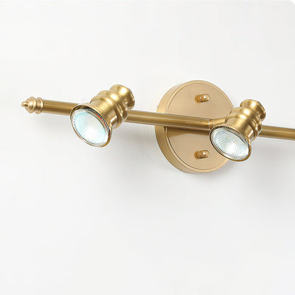 Close-up of two brass spotlight heads on a bar — Casa Norex