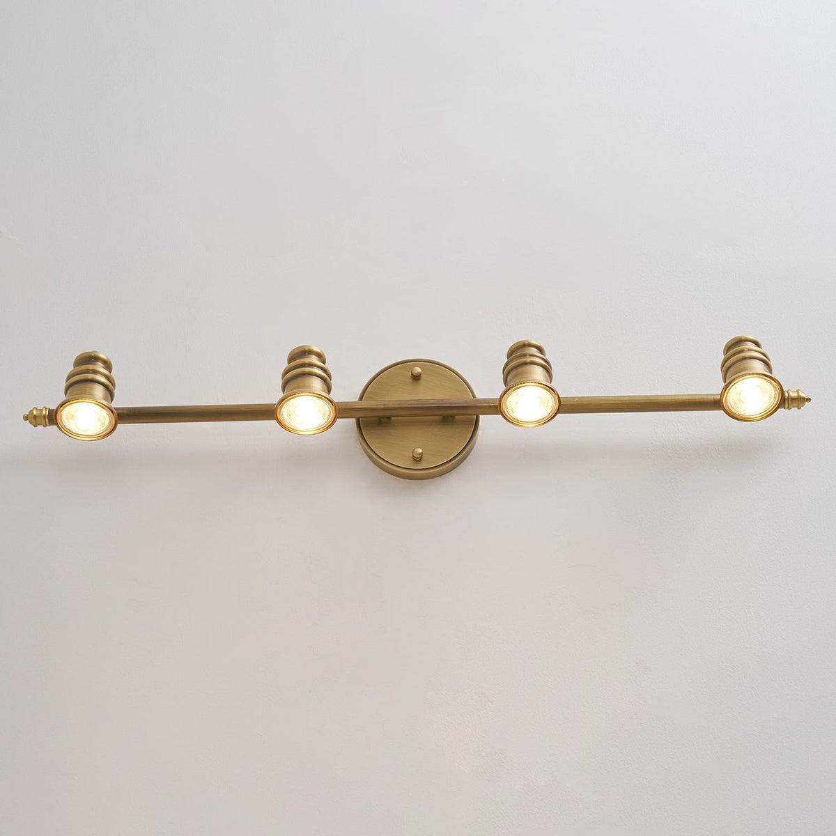 Macro view of the brass bar and mounting point of a spotlight head — Casa Norex
