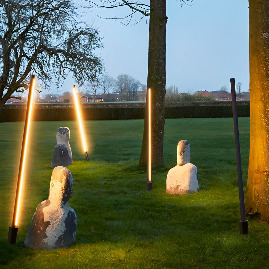 Linear floor lamp lit warm white on terrace — Casa Norex