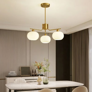Chandelier in dining room setting — round 3-light configuration | Casa Norex