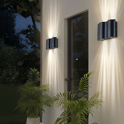 Wall light on courtyard exterior — dynamic light and shadow | Casa Norex