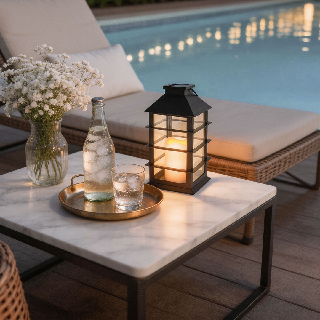 Wicklow black lantern on a marble table with a flower vase — Casa Norex