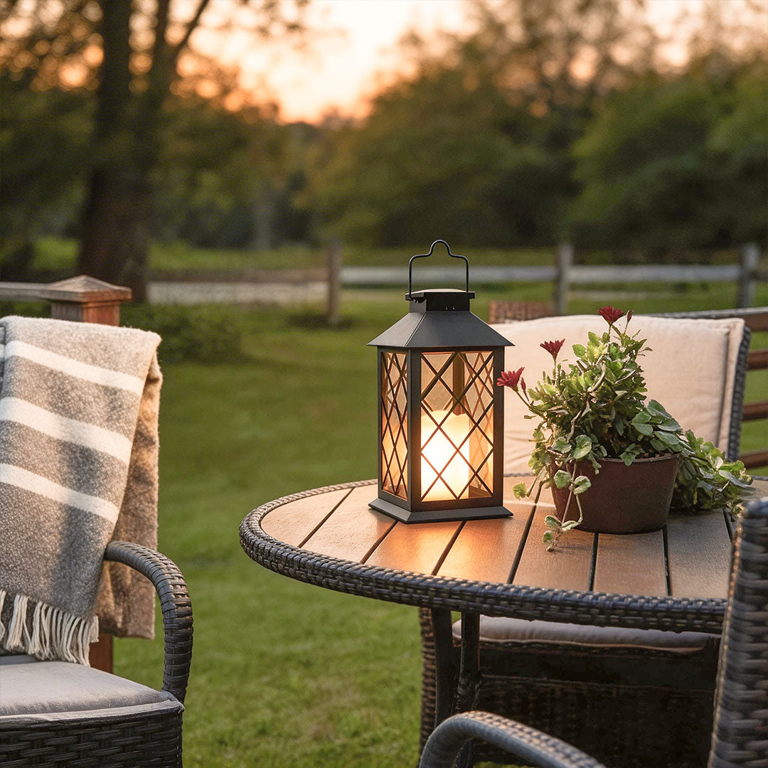 Wicklow black lantern on a patio table at sunset — Casa Norex