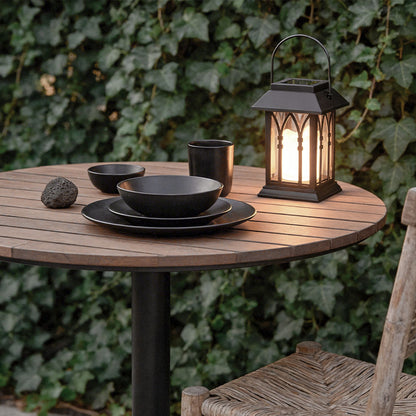 Wicklow lantern on a wooden dinner table with ivy decor — Casa Norex