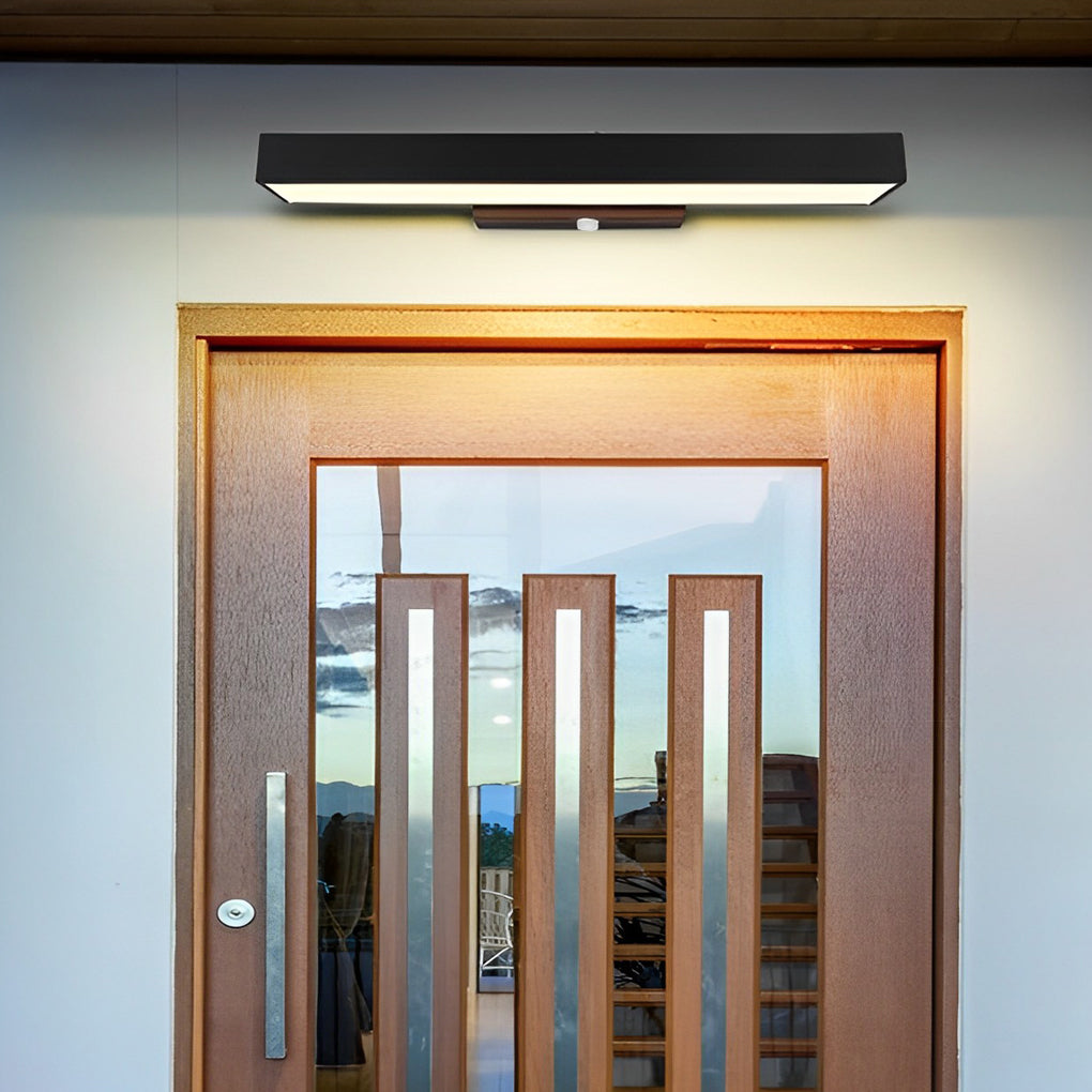 Tarver black linear light over an entry door — Casa Norex