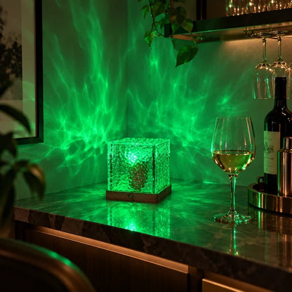 Green aurora light patterns cast on a wall by a northern lights cube lamp — Casa Norex