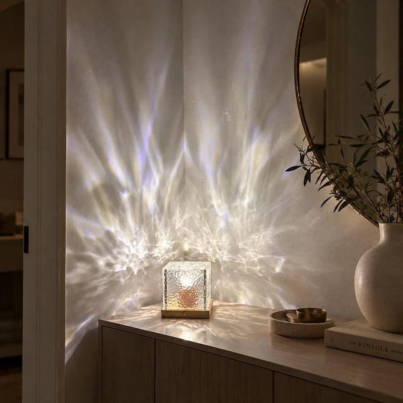 Soft white aurora light patterns on a wall beside a round mirror — Casa Norex