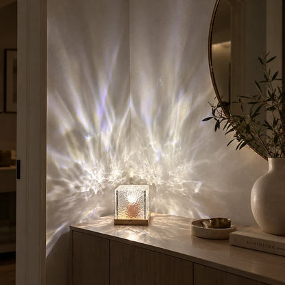 Soft white aurora light patterns on a wall beside a round mirror — Casa Norex