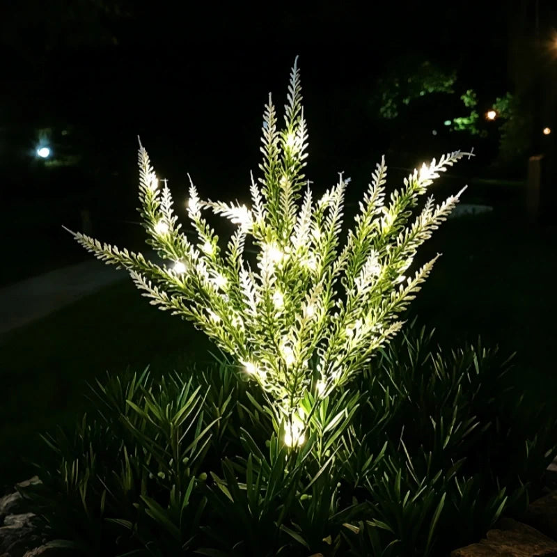 White lavender stake lights glowing on slim stems at night — Casa Norex