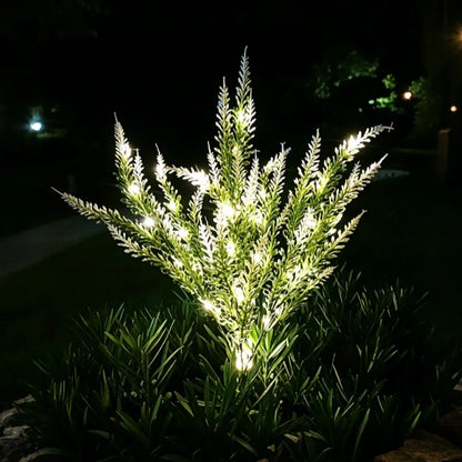 White lavender stake lights glowing on slim stems at night — Casa Norex