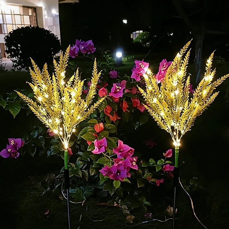 Yellow lavender stake lights lit among purple garden flowers — Casa Norex