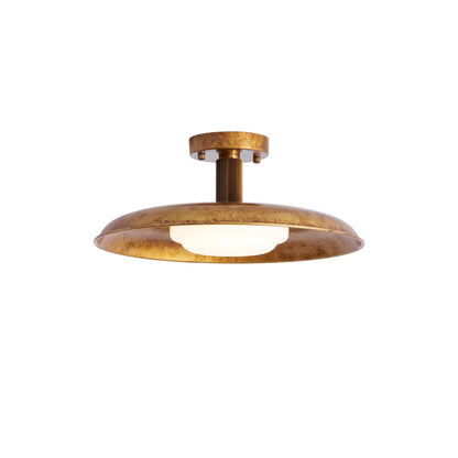 Close-up of the frosted glass diffuser on a gilded iron ceiling light | Casa Norex