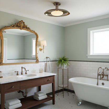 Gilded iron ceiling light above a traditional bathroom with an ornate mirror — Casa Norex