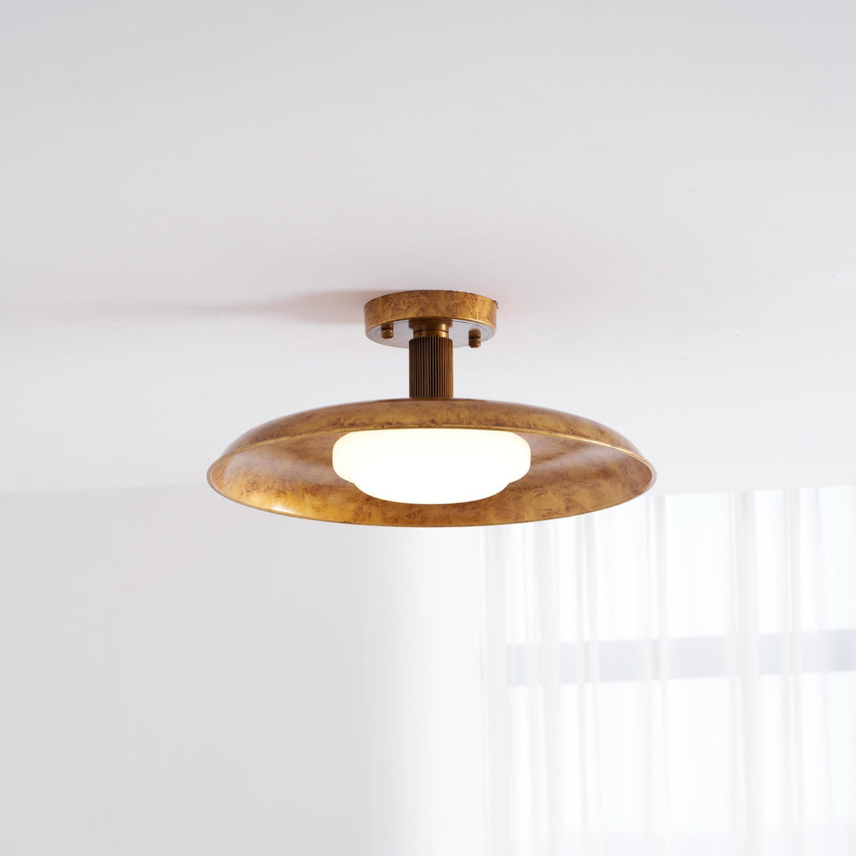 Gilded iron flush mount seen from the side on a white ceiling — Casa Norex