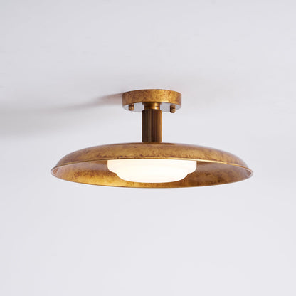 Gilded iron flush mount with a lit frosted glass diffuser — Casa Norex
