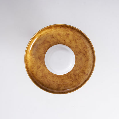 Gilded iron ceiling light seen from directly below, unlit — Casa Norex