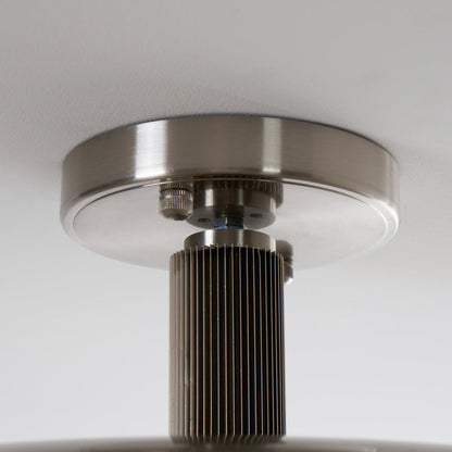 Close-up of the fluted polished nickel stem and canopy — Casa Norex