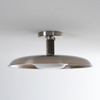 Polished nickel flush mount seen from the side on a grey ceiling — Casa Norex