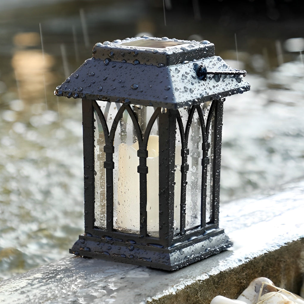 Wicklow lantern on a garden pathway with lush greenery — Casa Norex
